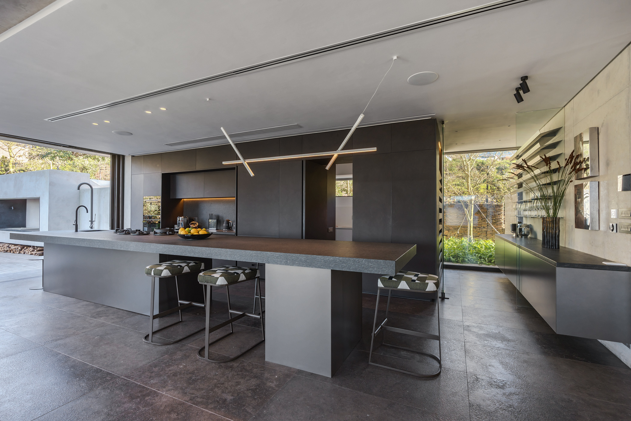 Kitchen material palette and sculpted island